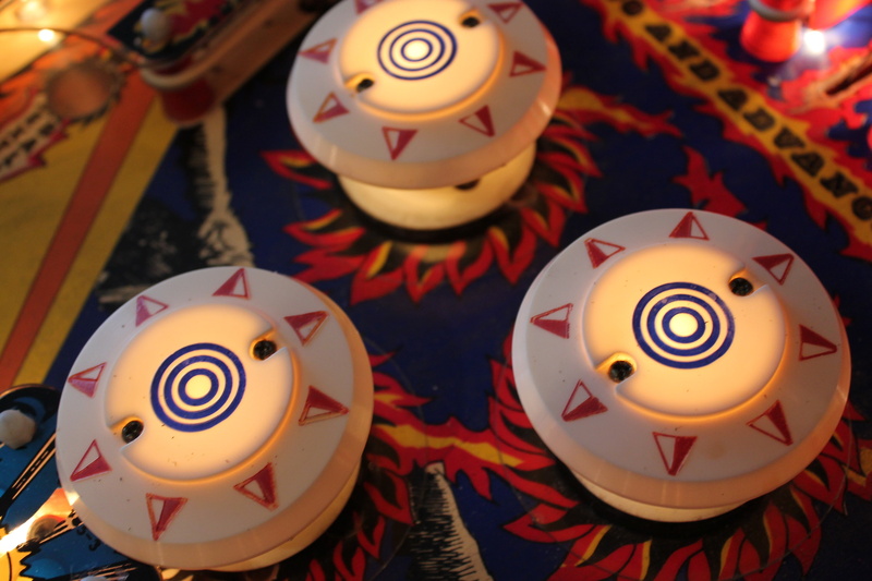 illuminated, pinball, shock tower, bumpers, three, group of objects, still life, close-up, williams, candle, large group of objects, representation, bumper