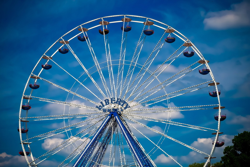 city, geometric shape, joy, large, fairground, nature, events, amusement park ride, low angle view, illuminated, hustle and bustle, cloud - sky, folk festival