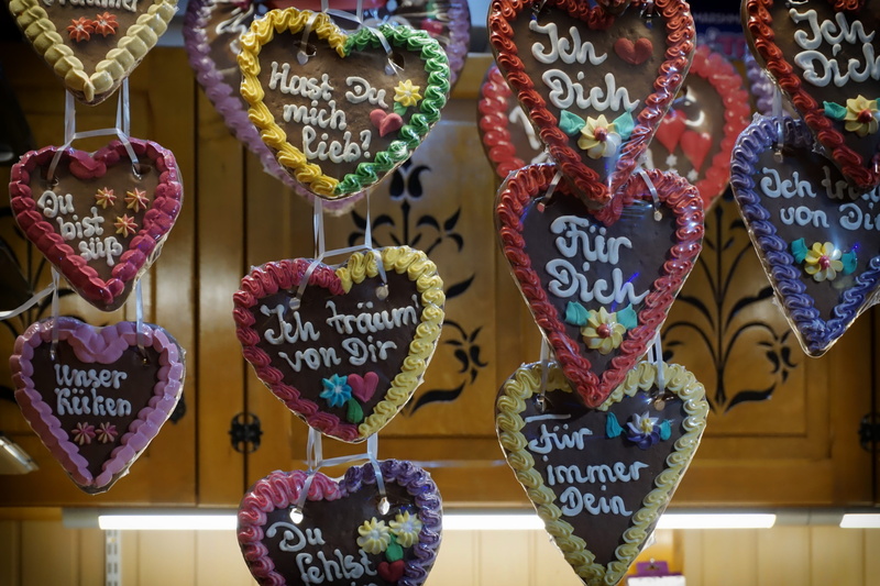 love, frosting, year market, gingerbread cookie, large group of objects, store, gingerbread heart, text, multi colored, market, no people, heart, script