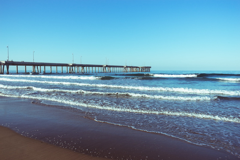 land, clear sky, sky, tranquility, sunrise, pier, nature, ocean, scenics - nature, built structure, beack, motion, outdoors, waves, dock, horizon over water