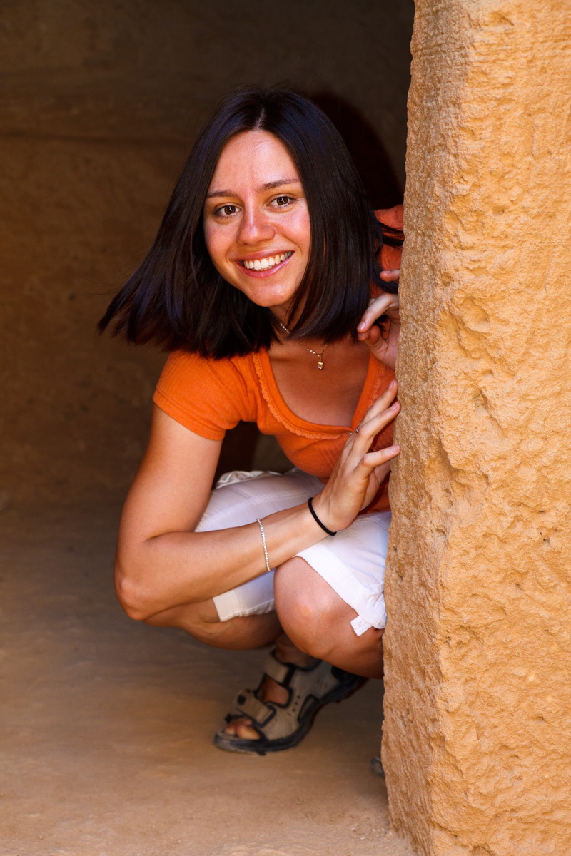 day, adults only, lifestyles, girl, Female, only women, woman, brown, long hair, seek, wall, near, people, leisure activity, sitting, looking at camera