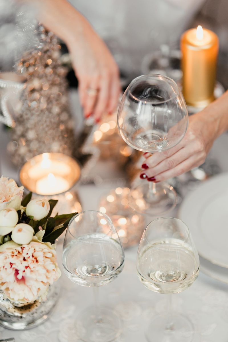 glass, 5K, fire, decorations, table, alcohol, human hand, lifestyles, holding, tea light, one person, hand, refreshment, household equipment, candle, indoors