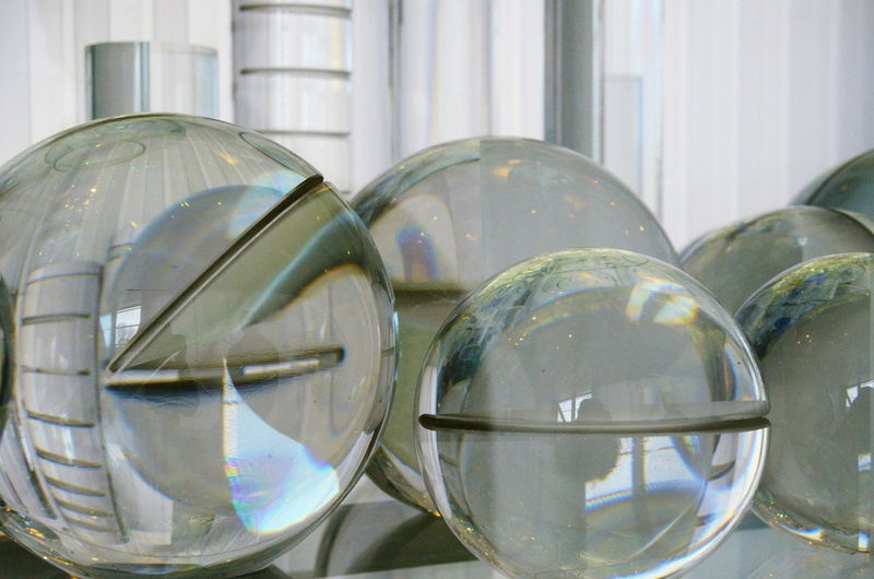silver colored, indoors, decoration, geometric shape, nature, still life, crystal ball, transparent, focus on foreground, ball, close-up, day, group of objects
