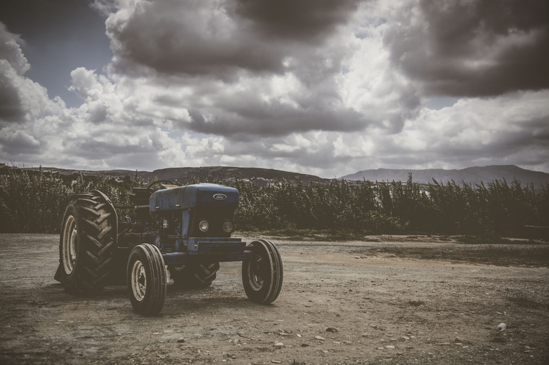 sky, tranquility, alloy wheel, tire, environment, vehicle, plant, non-urban scene, machine, outdoors, cloud - sky, daytime, countryside, mode of transportation