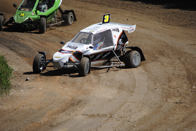 high angle view, land Vehicle, road, extreme Sports, sunlight, motorcycle, outdoors, wheel, competition, championship, absence, land, travel, dirt, sports Race