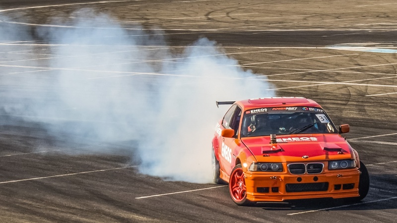 sign, fast, montmelo , drift, land Vehicle, burning, transportation, firefighter, competition, smoke - physical structure, road, day, burn out, sports Car