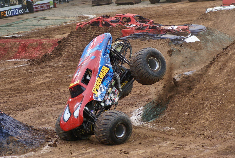 sports, mode of transportation, day, outdoors, motorcycle, monster truck, truck, motion, cool, high angle view, road, transportation, spiderman, 4x4, speed
