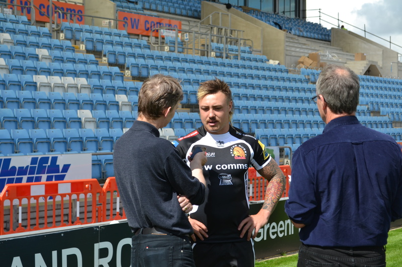 building exterior, real people, young women, communication, group of people, women, rugby, males, people, exeter chiefs, sport, adult, young men, standing