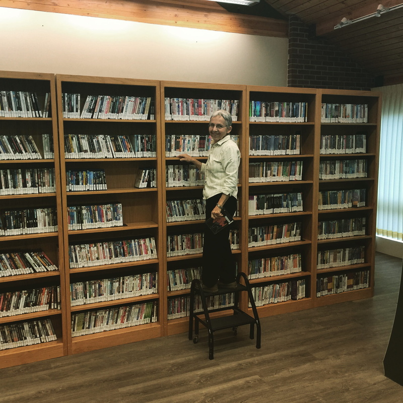 library, adam winger logan utah, learning, casual clothing, lifestyles, studying, indoors, books, full length, adult, shelf, service, senior, united states