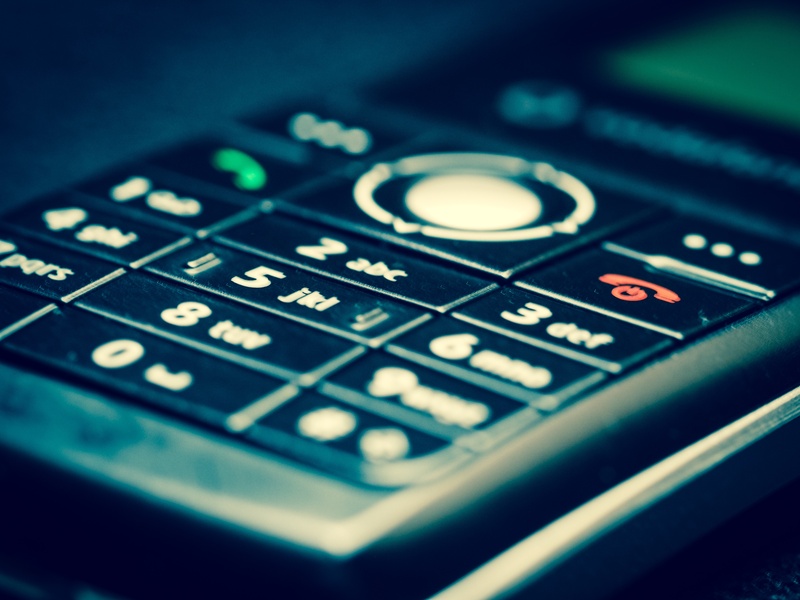 mobile phone, antenna, selective focus, single object, push button, black, call, letter, western script, talk, mustache, listen, illuminated, communication