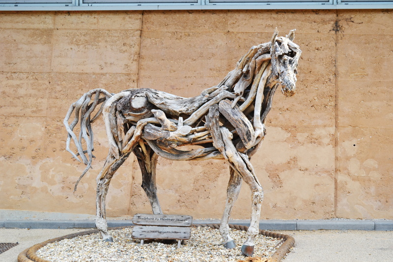 the past, sculpture, outdoors, architecture, project, sunlight, no people, wall - building feature, nature, building exterior, old, driftwood, animal themes