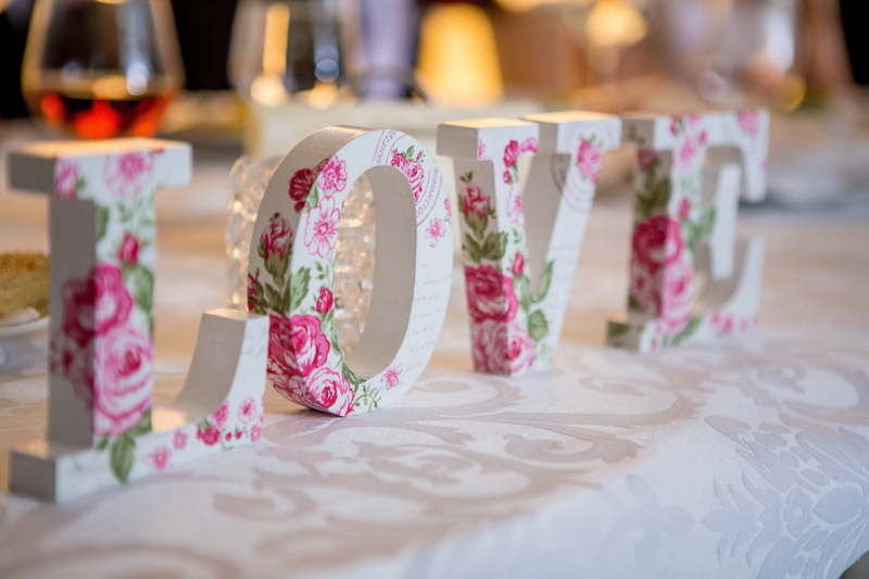 close-up, no people, celebration, happy, indoors, flower, craft, letters, in a row, color, gift, floral pattern, pattern, greeting, chair, design, creative