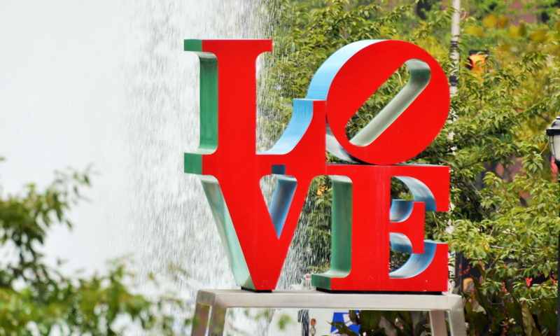 tree, focus on foreground, growth, love, sign, day, pole, love plaza, philadelphia, art, no people, western script, outdoors, green color, freestanding