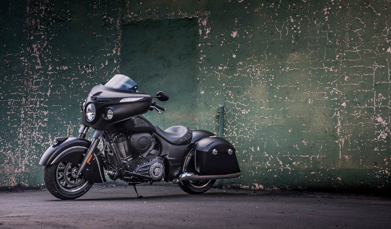 brick, built structure, land vehicle, mode of transportation, side view, transportation, motor scooter, architecture, one person, wall - building feature