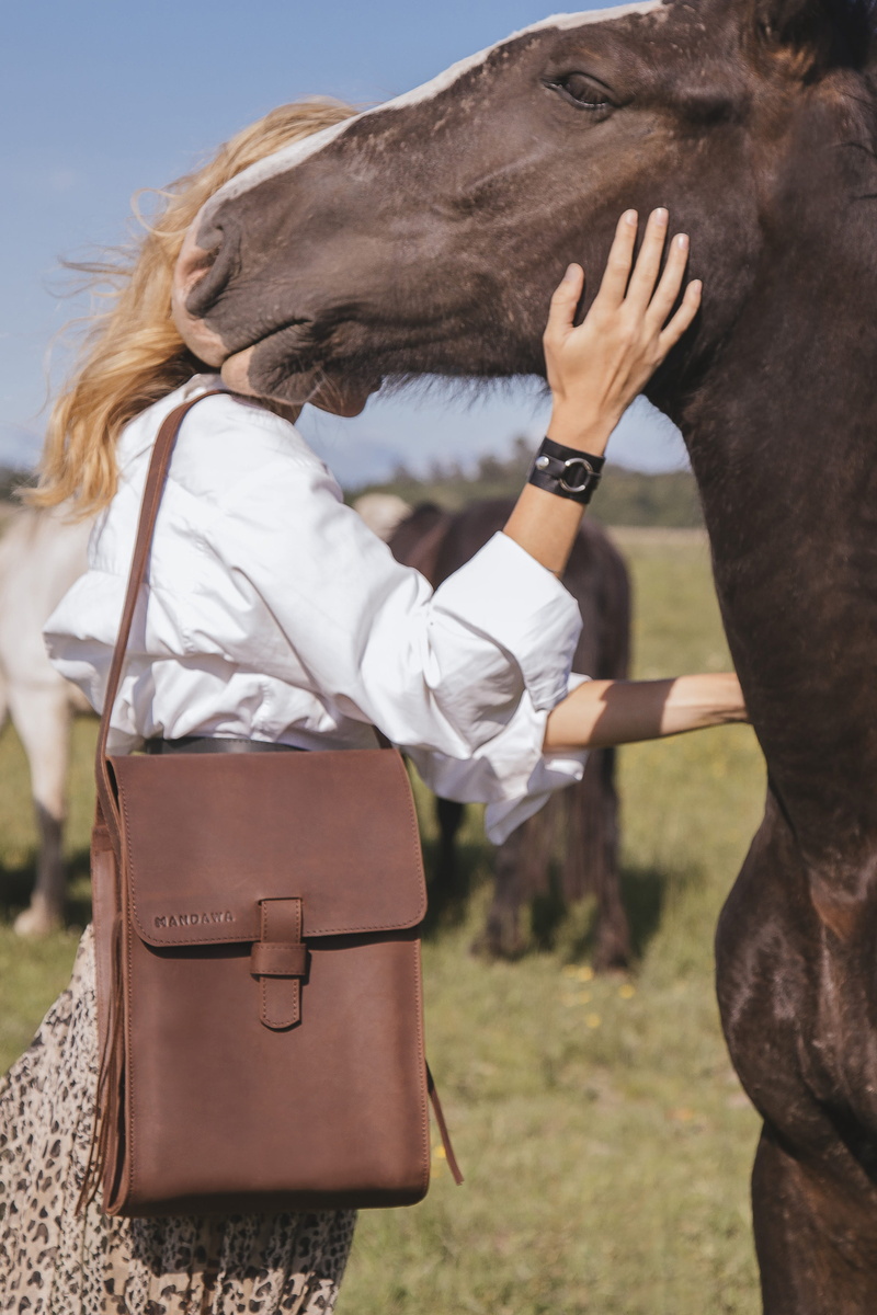 female, vertebrate, domestic animals, nature, handbag, mammal, accessories, one animal, herbivorous, outdoors, animal wildlife, human, doctor, field, human arm