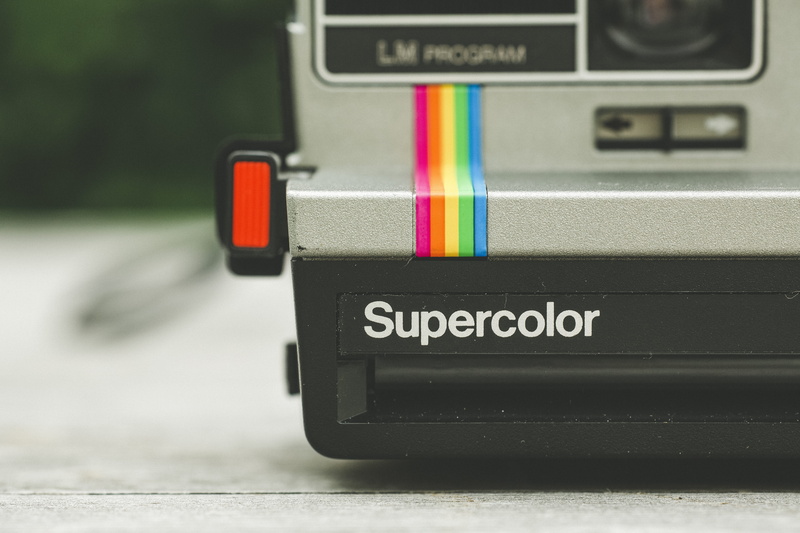 indoors, transportation, camera, silver, zoom, polaroid, selective, photographic, extreme close-up, superoclor, grey, text, single object, retro, professional