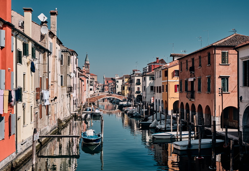 italy, outdoors, watercraft, nature, wooden post, clear sky, building, pier, building exterior, dock, built structure, chioggia, gondola - traditional boat