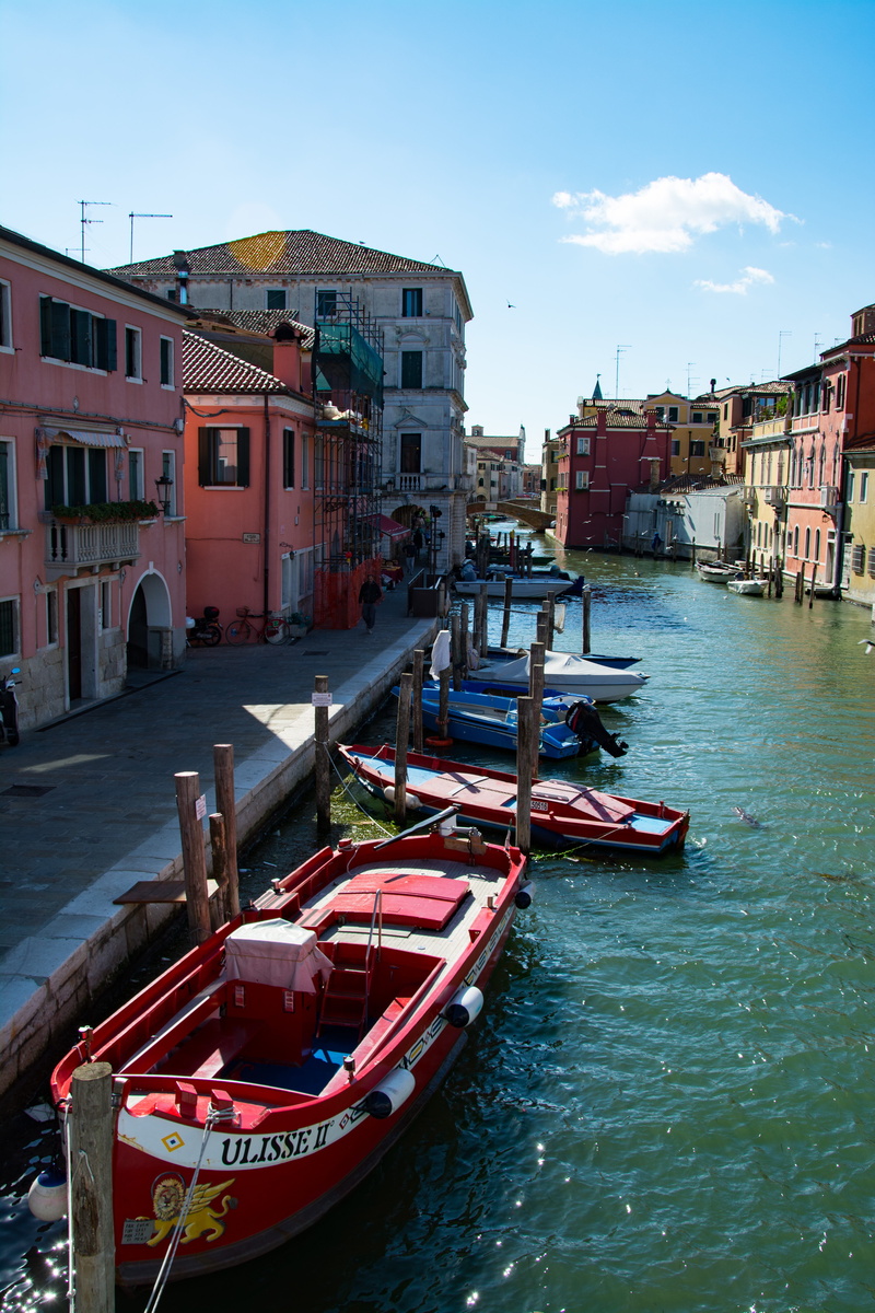 sea, canal, building exterior, italy, day, building, chioggia, water, wooden post, residential district, colourful houses, sky, travel destinations, nautical vessel