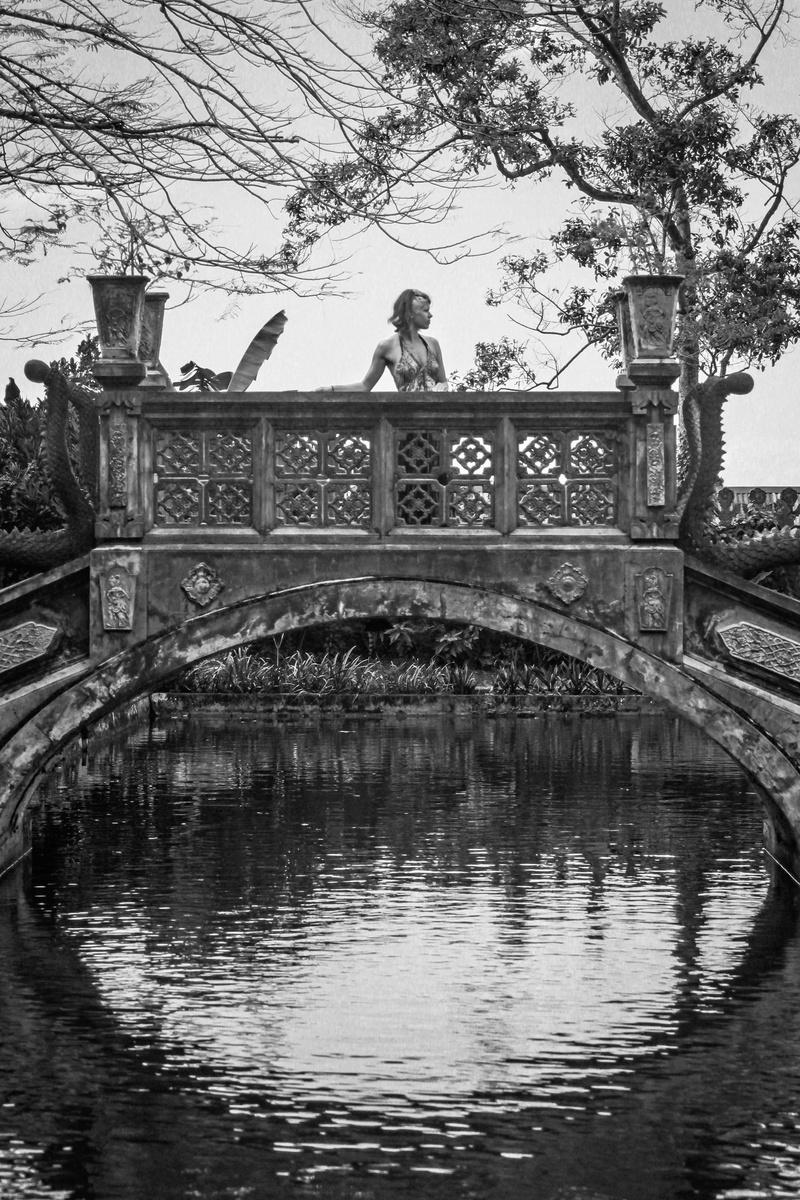 explore, built structure, dragon, indonesia, transportation, religious, waterfront, tirta gangga, alone, girl, footbridge, bridge - man made structure