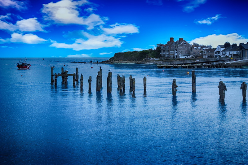 travel destinations, wooden post, built structure, tranquility, day, scenics - nature, ruins, blue, land, reflection, architecture, landscape, tranquil scene