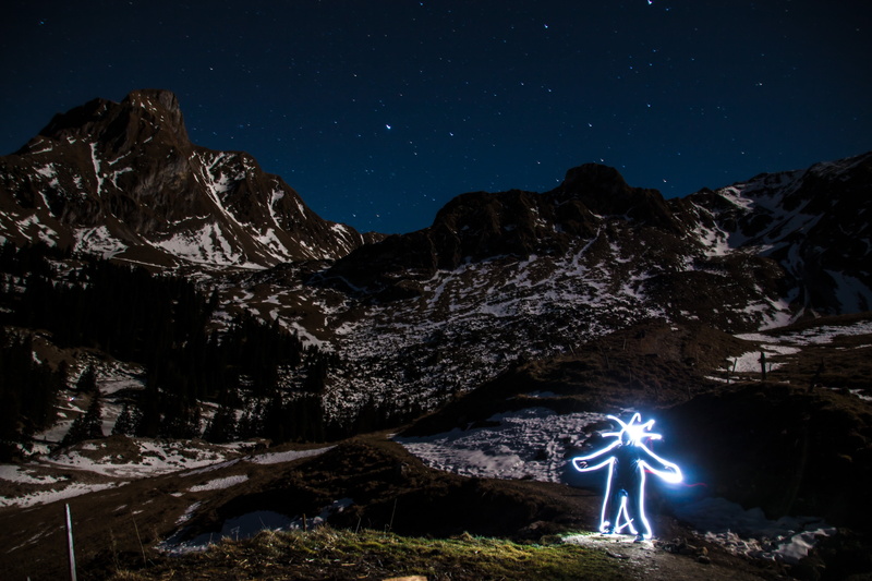 lights, astronomy, tranquil scene, real people, space, switzerland, standing, dark, mood, beauty in nature, formation, sky, mountains, gurnigel, tranquility