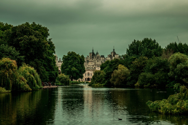 building, religion, green color, place of worship, building exterior, growth, st jamess park, plant, lake, built structure, london, sky, no people, outdoors