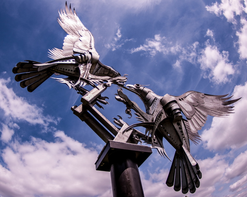 belief, sculpture, bird, outdoors, malvern, spread wings, plane, britain, cloud - sky, sky, low angle view, eagles, animal wildlife, statue, flying, england