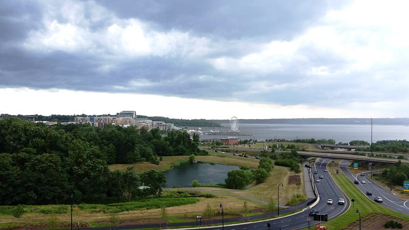 car, architecture, high angle view, building exterior, cloud - sky, nature, travel, mode of transportation, tree, land vehicle, urban, road, highway, water