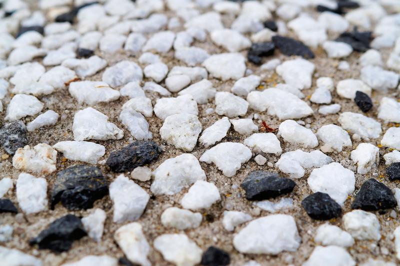 white color, 5K, large group of objects, stones, backgrounds, beach, plump, white, black, day, ground, abundance, stone formation, outdoors, focus on foreground