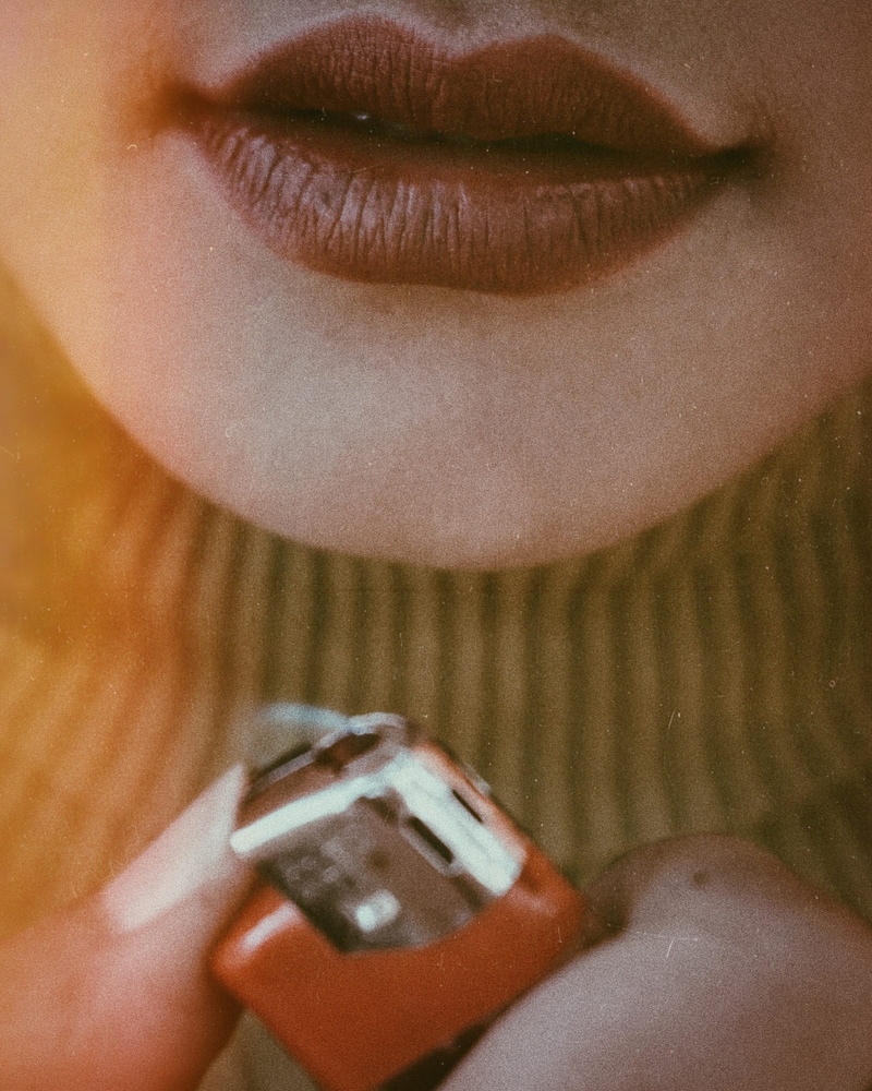 pen, female, lighter, human Face, lips, close up, technology, macro, females, femininity, studio Shot, beautiful, adult, women, caucasian Ethnicity, smiling