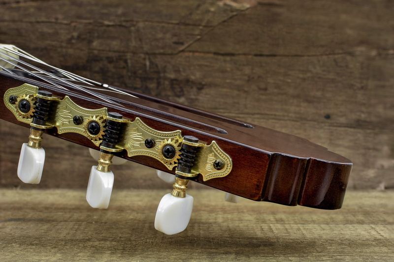 focus on foreground, instrument, gold, violin, wood, guitar, wood - material, musical instrument string, ornament, still life, musical instrument, table