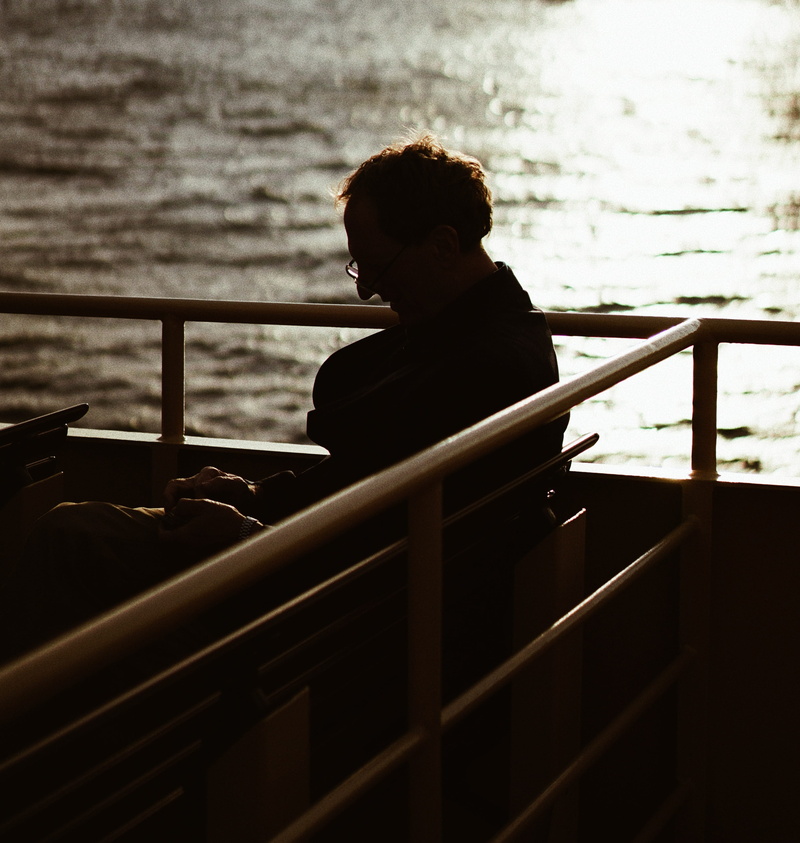 flooring, outdoors, human, three quarter length, clothing, 2K, silhouette, person, man, contemplation, men, real people, neck, looking at view, handrail