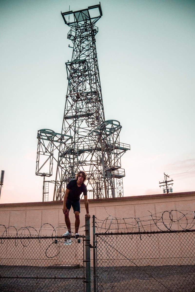 5K, industry, standing, energy, barbed wire, high, trespassing, electricity, built structure, full length, person, sky, station, man, one person, communication
