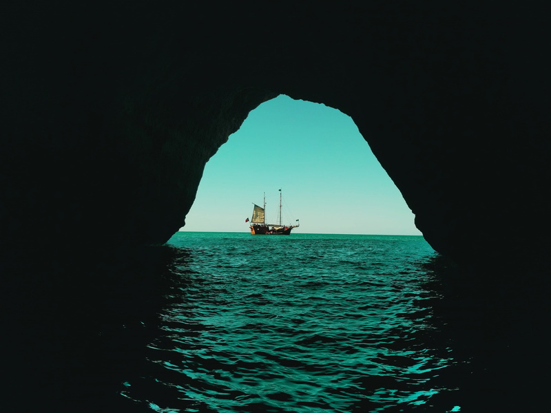 caves, nautical vessel, swimming, day, sky, ocean, sailing, tranquil scene, nature, no people, blue, waves, sea, transportation, cave, mode of transportation