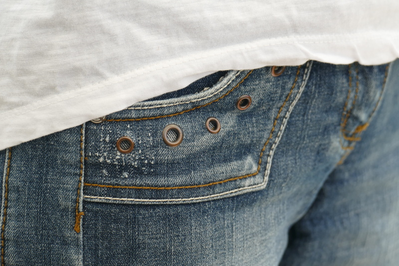 one person, pocket, Bag, jacket, stitched, casual clothing, washed out, human leg, indoors, close-up, garment, clothing, denim jacket, textile, clothes