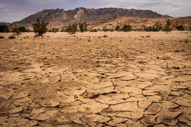 mud, environment, beauty in nature, soil, scenics - nature, tranquil scene, nature, outdoors, formation, clothing, extreme terrain, mountain range, coal