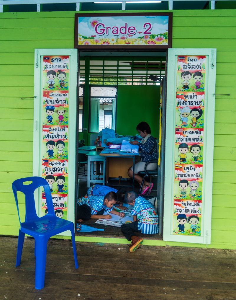 communication, full length, two people, children, sitting, students, adult, men, koh panyee island, business, women, leisure activity, vending machine