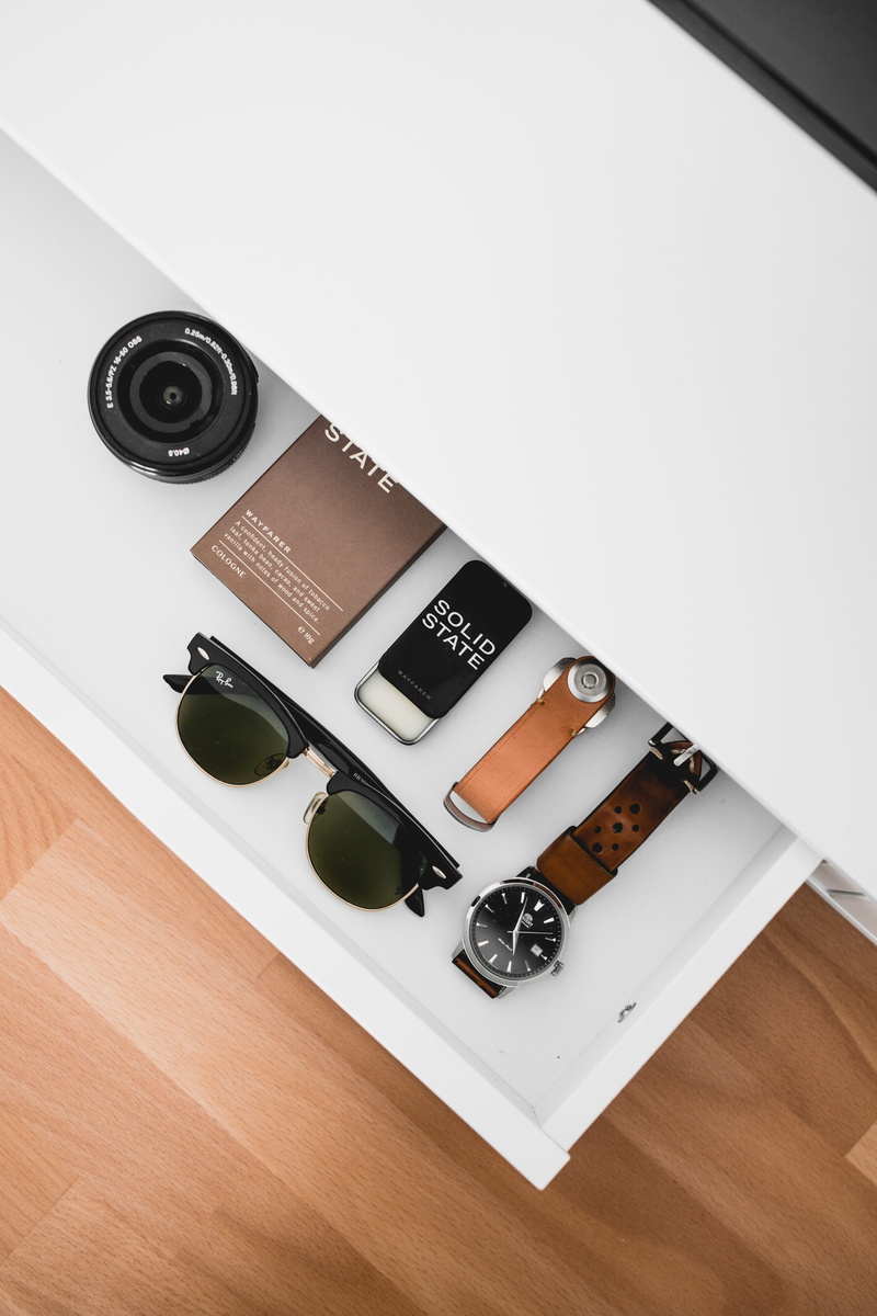lens, analog, ray-ban, communication, no people, leather, lens - optical instrument, dslr, indoors, black, surface, medium group of objects, neat, sunglass