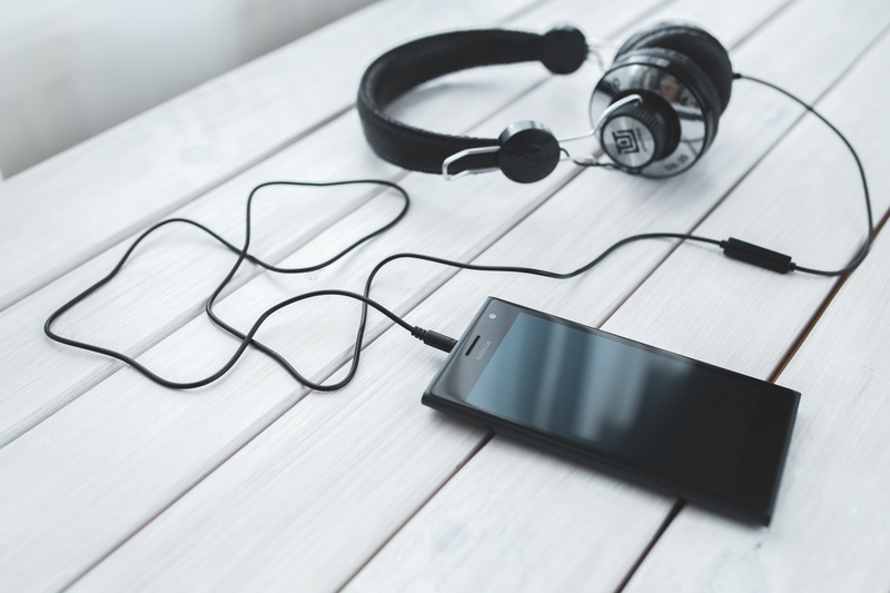 cell phone, mobile, personal accessory, gray, wood - material, equipment, headphones, 5K, corded, indoors, no people, black color, glasses, eyeglasses