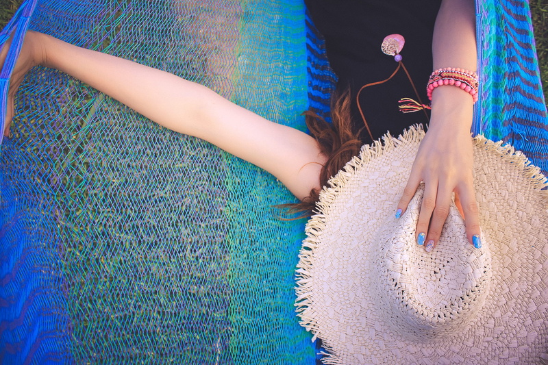 adult, relaxation, holding, sun, child, people, day, offspring, sun hat, leisure activity, childhood, women, one person, low section, females, human body part
