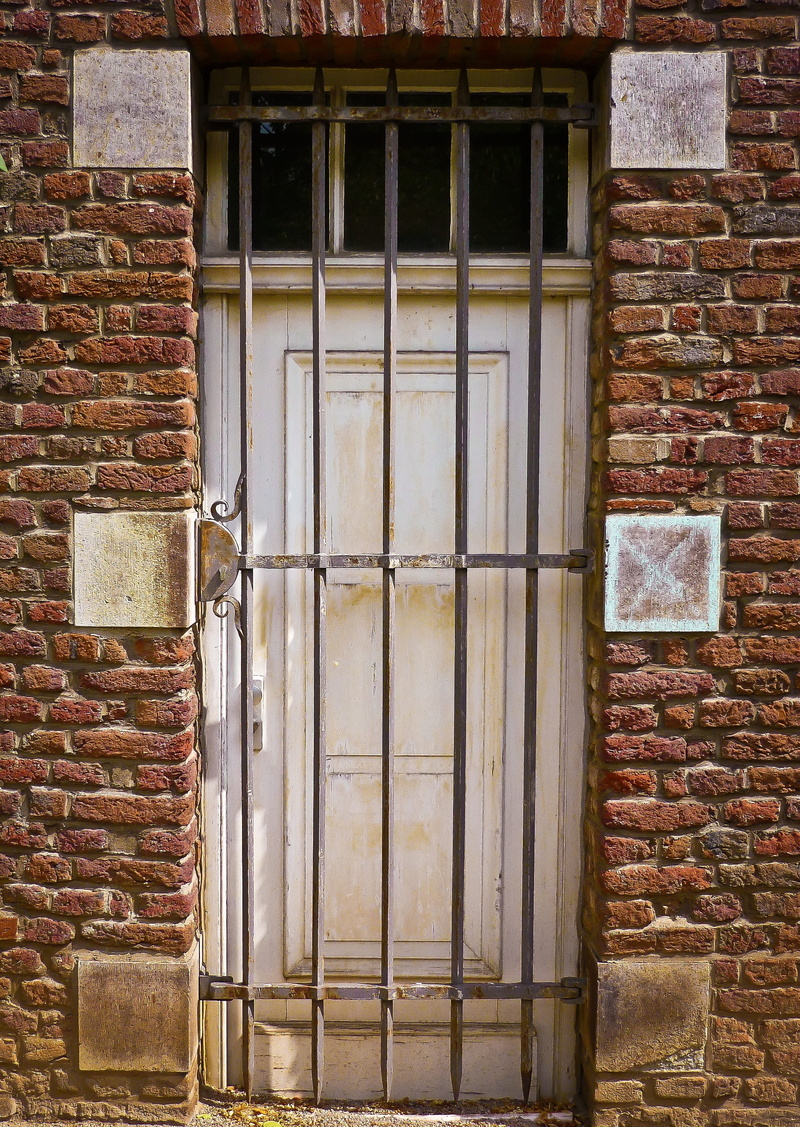 safety, entrance, facade, building, building exterior, built structure, outdoors, wall, closed, door, metal, no people, grid, brick wall, input, architecture