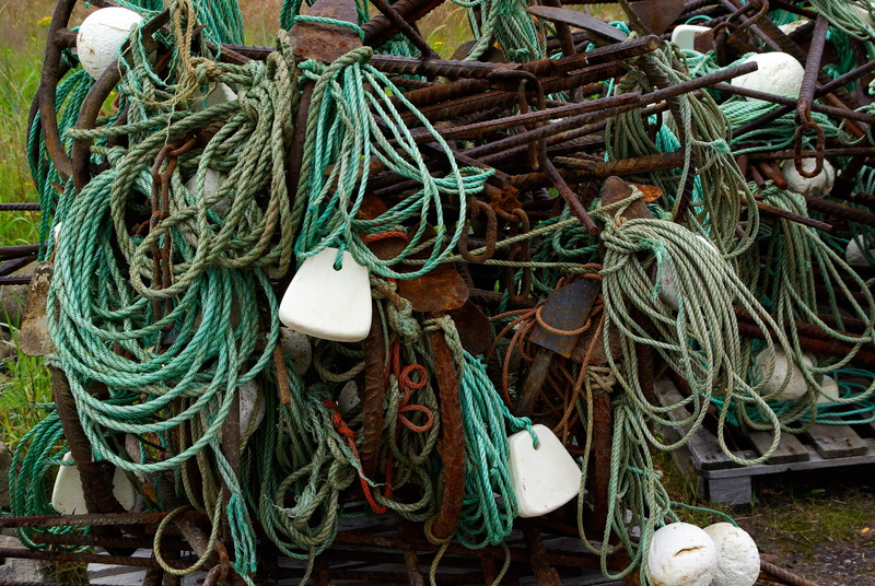 no people, sea, still life, fishing industry, full frame, high angle view, floats, green color, tangled, commercial fishing net, rod, outdoors, buoy, backgrounds