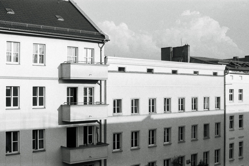 city life, ilford, city, film, sky, roof, cloud - sky, clouds, low angle view, building exterior, side by side, window, racionalism, built structure, scene