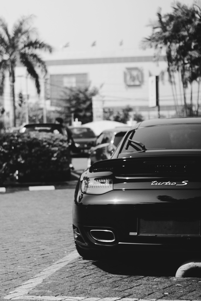 built structure, cars, porsche turbo s, porsche, day, transportation, selective focus, motor vehicle, outdoors, focus on foreground, street, incidental people