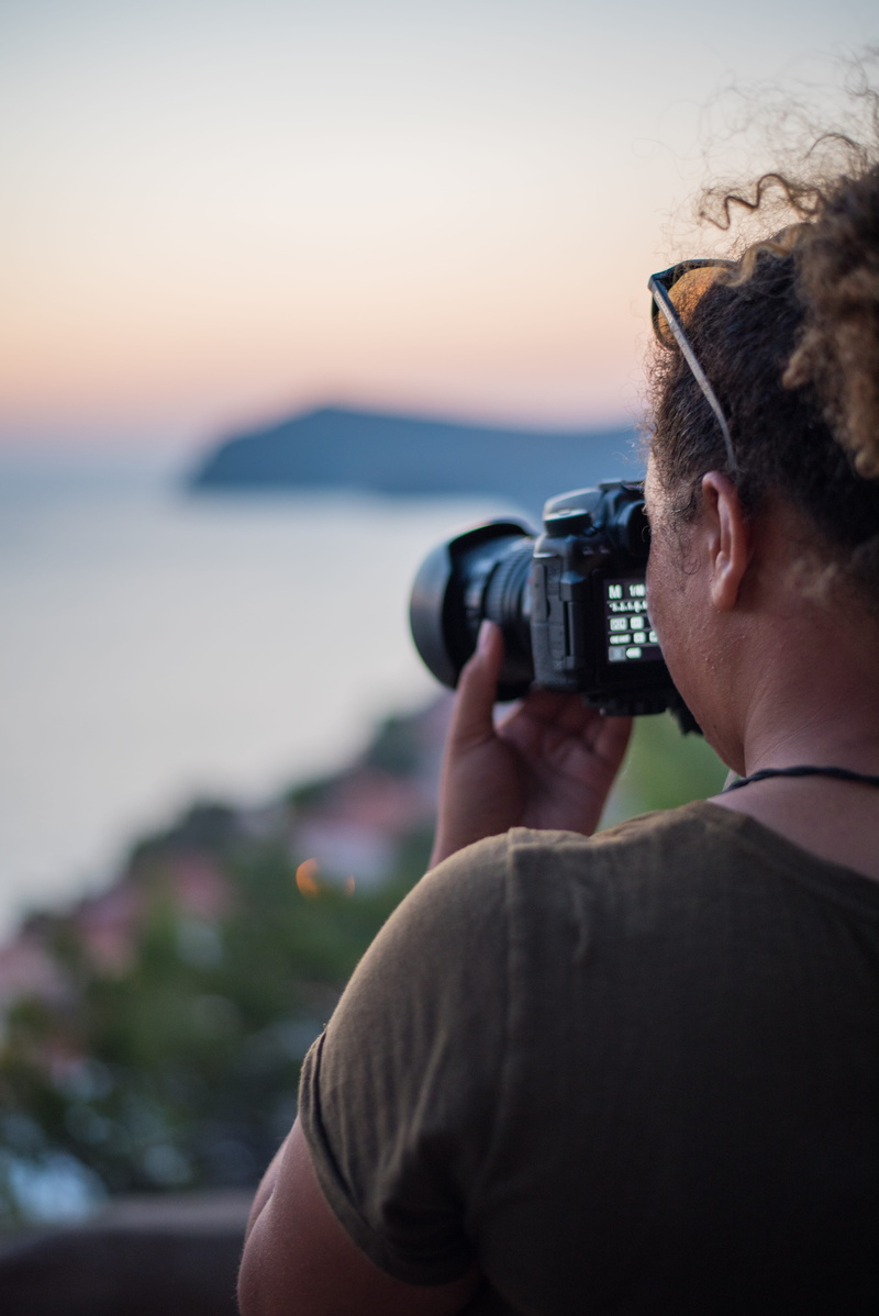 nikon, electronics, holding, lesbos, water, lesvos, views, camera - photographic equipment, leisure activity, person, outdoors, tog, sunset, one person