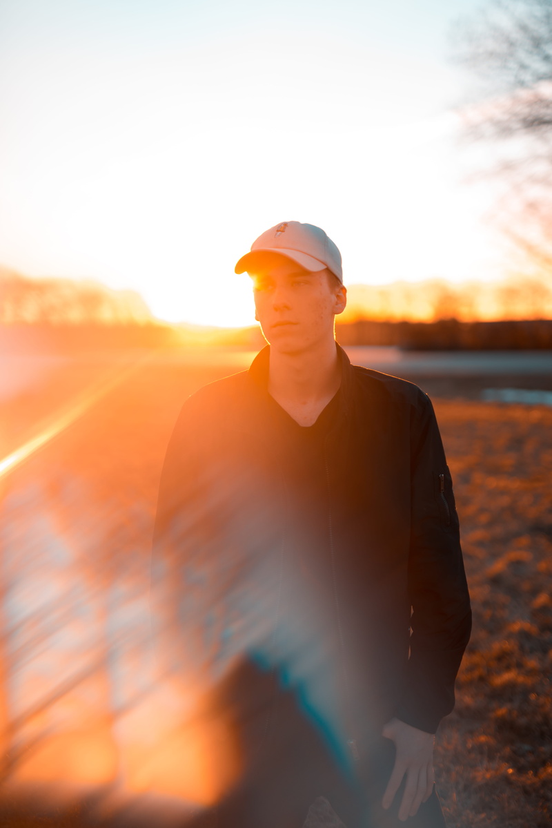 hat, jæren, yellow, waist up, flare, daniel tafjord, lifestyles, guy, one person, outline, orange color, reflection, orange, standing, three quarter length