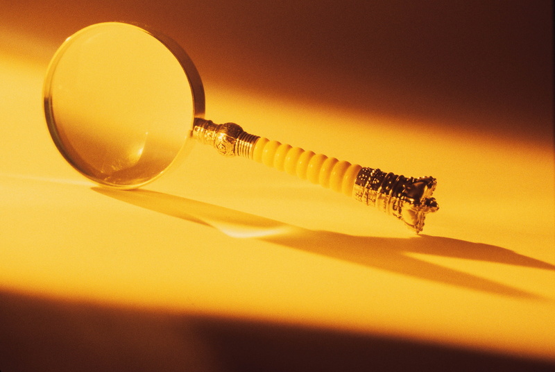 two objects, shiny, steel, illuminated, indoors, equipment, 2K, table, magnification, focus on foreground, light Bulb, shadow, still life, ideas, loupe