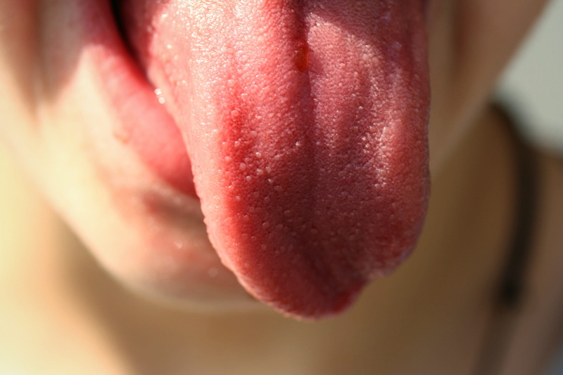 close-up, frozen, Human, Person, focus, stick out tongue, 2K, Tongue, single object, photography, Child, human body part, indoors, food, flavored ice