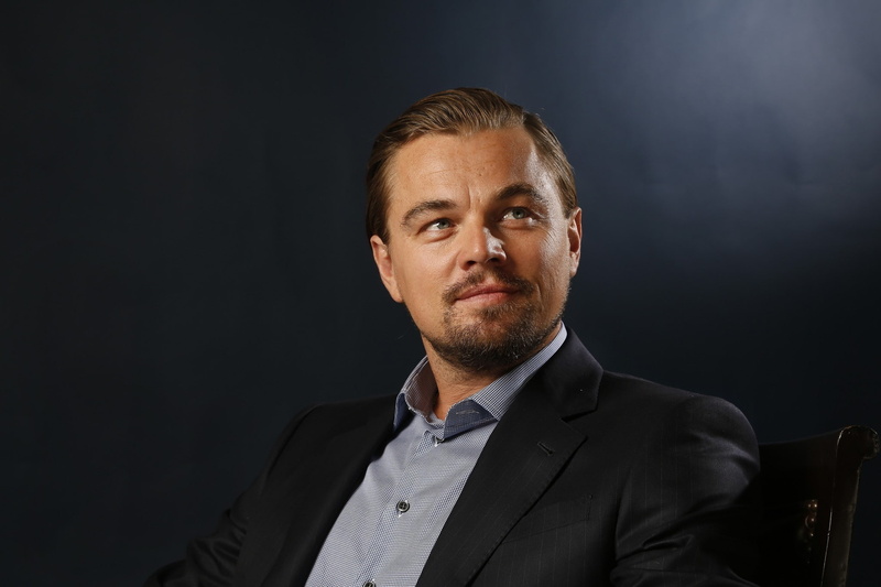 leonardo, businessman, business, black background, chair, headshot, one person, face, confidence, men, formalwear, Leonardo DiCaprio, serious, males, studio shot