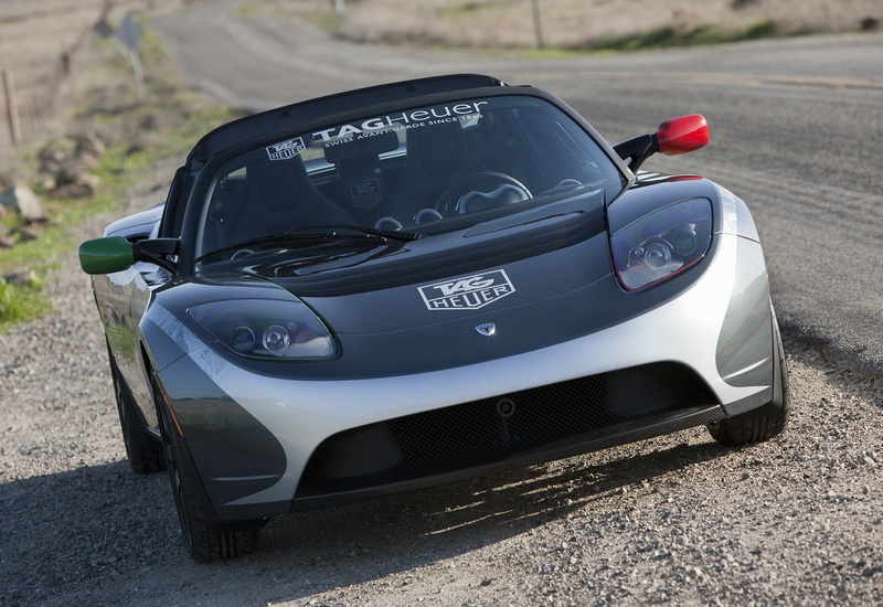 sunlight, car, road, focus on foreground, land vehicle, day, (2010), nature, tag, number, tesla, mode of transportation, motor vehicle, transportation